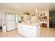Bright kitchen features a center island and ample cabinet space for storage at 1390 E Airport Blvd, Sanford, FL 32773