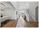 Bright, grand foyer with high ceilings, chandelier, hardwood floors, and an elegant staircase at 13924 Jomatt Loop, Winter Garden, FL 34787