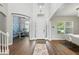 Welcoming entry with high ceilings, wood floors, and arched doorway leading to a study at 13924 Jomatt Loop, Winter Garden, FL 34787