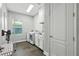 Well-equipped laundry room with modern washer, dryer, and ample storage cabinets at 13924 Jomatt Loop, Winter Garden, FL 34787