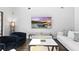 Inviting living room with comfortable seating, modern entertainment center, and bright natural light at 13924 Jomatt Loop, Winter Garden, FL 34787