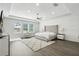 Serene main bedroom boasts tray ceilings, natural light, and a luxurious textured accent wall at 13924 Jomatt Loop, Winter Garden, FL 34787