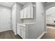 Mud room with extra storage space and quartz countertop at 13924 Jomatt Loop, Winter Garden, FL 34787