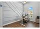 Study featuring diagonal molding accent wall, an ergonomic desk, and natural light at 13924 Jomatt Loop, Winter Garden, FL 34787