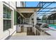 Well-equipped outdoor kitchen with modern appliances, including a grill and beverage cooler at 13924 Jomatt Loop, Winter Garden, FL 34787