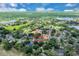 Expansive aerial view of a residential community with lush greenery, serene lakes, and beautiful homes at 1484 Lake Francis Dr, Apopka, FL 32712