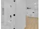 Clean bathroom with white fixtures, a tub, and a marble tiled floor at 1484 Lake Francis Dr, Apopka, FL 32712