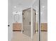 Bathroom featuring an open shower with modern tile, double vanity and updated lighting fixtures at 1484 Lake Francis Dr, Apopka, FL 32712