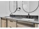 Modern bathroom featuring a double sink vanity with dark countertops and brushed nickel accents at 1484 Lake Francis Dr, Apopka, FL 32712