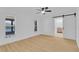 Bright bedroom showcasing two windows, recessed lighting, ceiling fan, and an en-suite bathroom at 1484 Lake Francis Dr, Apopka, FL 32712
