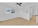 Bright bedroom showcasing new vinyl floors, a window, ceiling fan and closet at 1484 Lake Francis Dr, Apopka, FL 32712