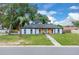 Charming single-story home features a freshly painted exterior, manicured lawn and a welcoming entrance at 1484 Lake Francis Dr, Apopka, FL 32712