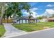 Well-maintained home exterior with a neatly landscaped front yard and a paved walkway, located in a friendly neighborhood at 1484 Lake Francis Dr, Apopka, FL 32712