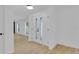 A light-filled foyer featuring bright, neutral walls, double doors, and wood-look flooring at 1484 Lake Francis Dr, Apopka, FL 32712