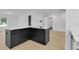 Well-lit kitchen with a large island with a marble countertop and ample storage at 1484 Lake Francis Dr, Apopka, FL 32712