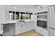 Modern kitchen with white cabinets, stainless steel appliances, and a window overlooking the backyard at 1484 Lake Francis Dr, Apopka, FL 32712