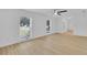 Bright and airy living room with hardwood floors, large windows and a modern ceiling fan at 1484 Lake Francis Dr, Apopka, FL 32712