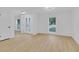 Sunlit living room featuring new vinyl floors, modern lighting and large windows at 1484 Lake Francis Dr, Apopka, FL 32712