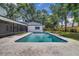 Backyard oasis with a refreshing pool, perfect for relaxation and enjoying the outdoors with a covered patio at 1484 Lake Francis Dr, Apopka, FL 32712