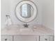 Clean and modern bathroom with white marble countertop and silver accents at 1526 Euston Dr, Reunion, FL 34747