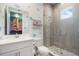 Charming bathroom featuring a modern vanity, tiled shower, and playful aquatic-themed decor at 1526 Euston Dr, Reunion, FL 34747