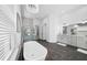 Bright bathroom featuring a freestanding tub, a marble shower, and double sink vanities at 1526 Euston Dr, Reunion, FL 34747