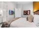 This bedroom features a mounted TV, modern décor, and an attached bathroom at 1526 Euston Dr, Reunion, FL 34747