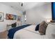 Stylishly furnished bedroom featuring modern decor, a sleek desk, and ample natural light at 1526 Euston Dr, Reunion, FL 34747