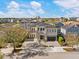 Gorgeous two-story home featuring a paved driveway and a grand entrance with stone accents at 1526 Euston Dr, Reunion, FL 34747