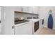 Efficient laundry room featuring modern appliances and ample storage space at 1526 Euston Dr, Reunion, FL 34747