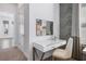 Stylish office nook features modern desk with drawers, modern chair, and accent mirror at 1526 Euston Dr, Reunion, FL 34747