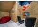 Unique playroom with 'Chamber of Secrets' theme featuring beanbag chairs and a television for immersive entertainment at 1526 Euston Dr, Reunion, FL 34747