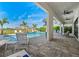 Inviting outdoor pool and patio area with comfortable seating and beautiful landscaping, perfect for relaxation and entertainment at 1526 Euston Dr, Reunion, FL 34747