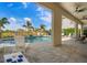 Luxurious pool area with multiple lounge chairs, a soothing water feature, and serene views of the community at 1526 Euston Dr, Reunion, FL 34747