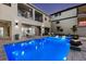 A backyard oasis with a large pool, comfortable seating, and a two-story home with balconies, perfect for outdoor living at 1526 Euston Dr, Reunion, FL 34747
