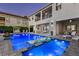 Beautiful backyard pool with built-in lounge chairs, spa, outdoor seating and a modern home, perfect for relaxing and entertaining at 1526 Euston Dr, Reunion, FL 34747