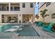 Backyard pool area with submerged lounge chairs, and outdoor seating areas at 1526 Euston Dr, Reunion, FL 34747