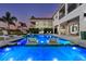 Stunning backyard pool featuring in-pool loungers, a cozy cabana, and a lush landscape, ideal for ultimate relaxation and enjoyment at 1526 Euston Dr, Reunion, FL 34747