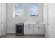 Wet bar with white cabinets, granite countertop, a sink, and a wine refrigerator for storage at 1526 Euston Dr, Reunion, FL 34747