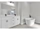 Bright bathroom featuring a vanity with double sinks and a modern freestanding bathtub at 15300 Sw 62Nd Ct, Ocala, FL 34473
