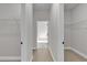 Bright hallway featuring closet doors with ample storage space and doorways to other rooms at 15300 Sw 62Nd Ct, Ocala, FL 34473