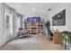 Inviting home office space with custom shelving, a comfortable rocking chair, and abundant natural light at 17676 Passionflower Cir, Clermont, FL 34714