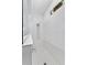 Bright, tiled walk-in shower with overhead showerhead and window; side bench offers additional space at 17676 Passionflower Cir, Clermont, FL 34714
