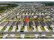 Aerial view of home with a map pin icon on the roof in a neighborhood with identical homes at 1792 Bull Hill Rd, Kissimmee, FL 34744