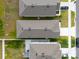 Aerial shot looking straight down on the roof and neighborhood houses at 1792 Bull Hill Rd, Kissimmee, FL 34744