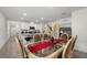 Elegant dining area with modern decor adjacent to a kitchen with granite countertops at 1792 Bull Hill Rd, Kissimmee, FL 34744