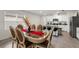 Bright dining room features luxury wood-trim table and flows into the open-concept kitchen at 1792 Bull Hill Rd, Kissimmee, FL 34744