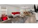 Comfortable living room adjacent to the dining area featuring tile floors and neutral walls at 1792 Bull Hill Rd, Kissimmee, FL 34744