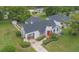 Aerial view of the home with a large backyard, mature trees, and the surrounding neighborhood at 2101 Lily Ct, Sanford, FL 32771