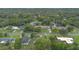 Scenic aerial view showcases a well-spaced suburban community nestled among lush greenery and mature trees at 2101 Lily Ct, Sanford, FL 32771